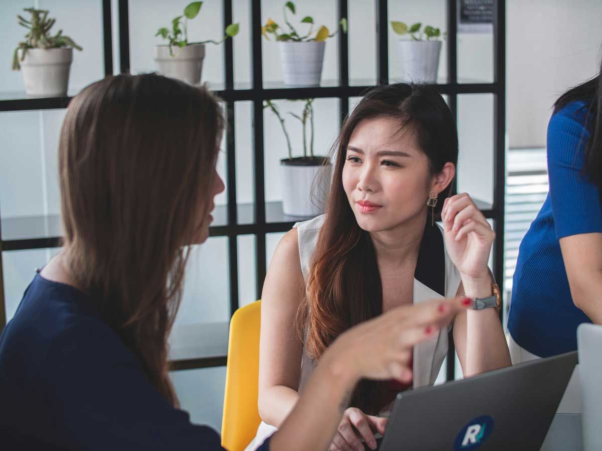 Two women executives in a discussion