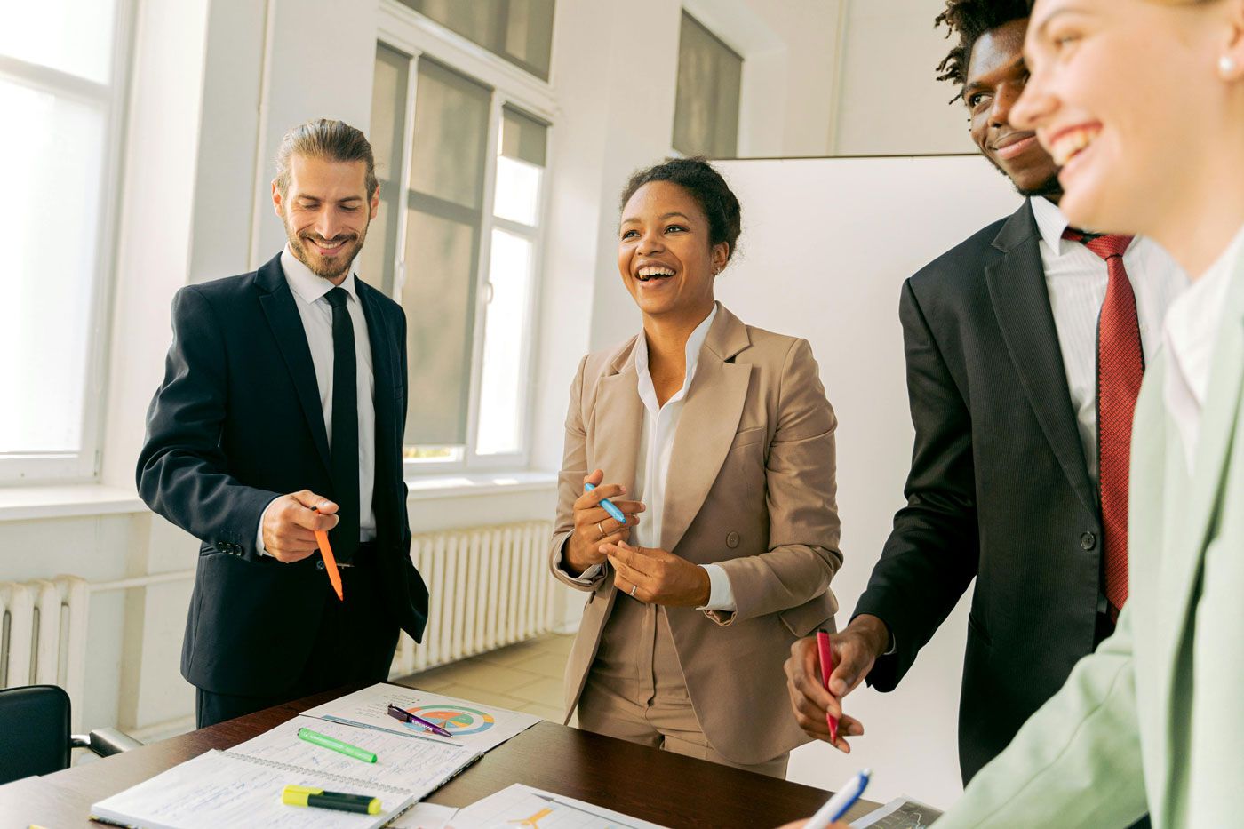 A group of executive search professionals in a coaching and development discussion