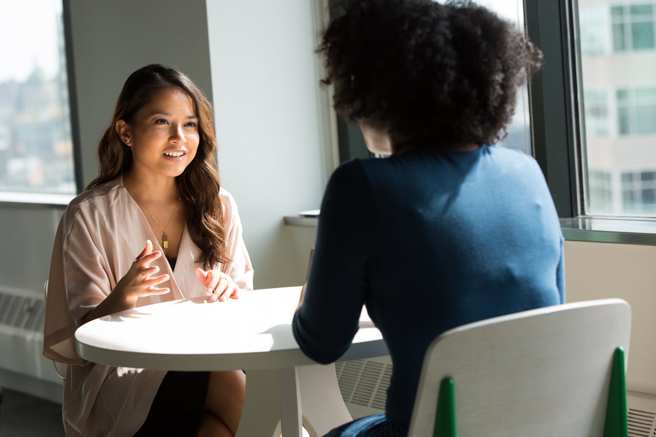 Female executives in a coaching and development discussion